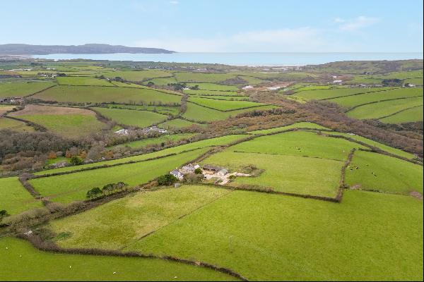 A beautifully refurbished farmhouse, within sight of the glorious Cornish coast, in a peac