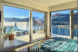 Large roof terrace & breathtaking lake view: modern penthouse apartment in Montagnola for