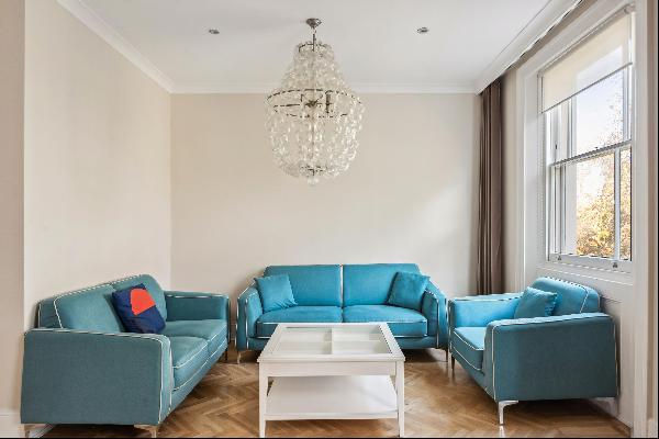 A three-four bedroom, share of freehold flat for sale on St Georges Square, Pimlico, SW1V.