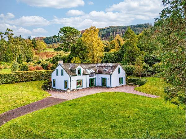 A beautifully presented, architect-designed, family home with fabulous views over Loch Lin