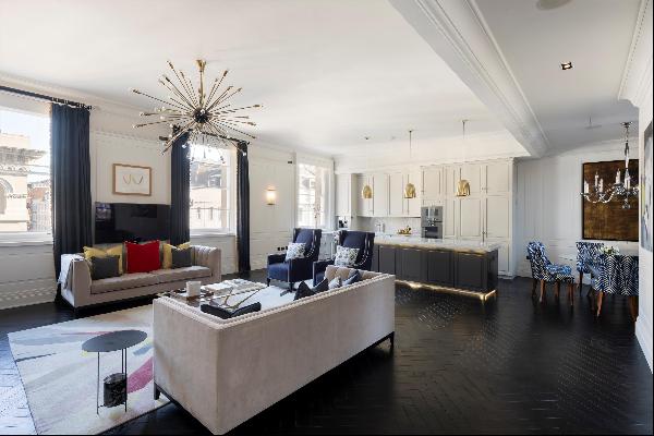 A two/three bedroom flat with high ceilings in the centre of Covent Garden.