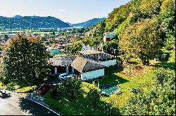 Lugano-Agno: villa for sale, prime for renovation, boasting a large plot, indoor pool & s