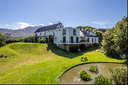 PARADISAL RESIDENCE ON SPRAWLING GROUNDS IN THE COVETED CONSTANTIA VALLEY.