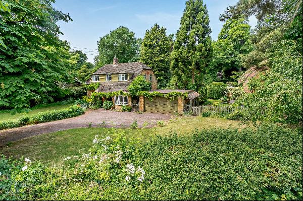 A lovely countryside home in need of modernisation situated in glorious gardens with a won