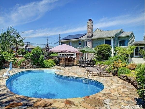Amazing Oversized Property Sitting on Two Lots Just Seconds Away From The Beach in West Li