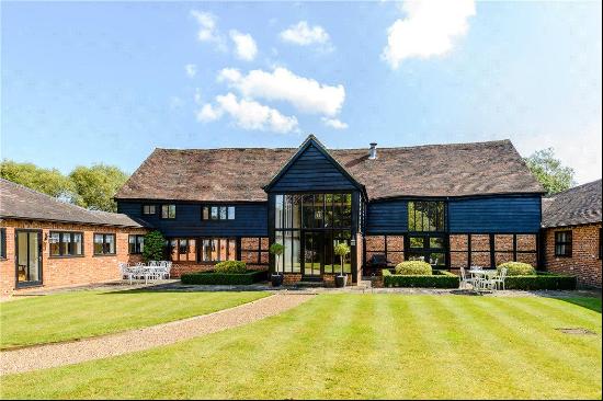 A charming Grade ll listed barn conversion surrounded by open countryside.