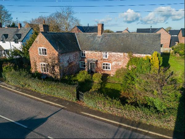 A charming period property set in the village of Knockin, with potential to develop into a