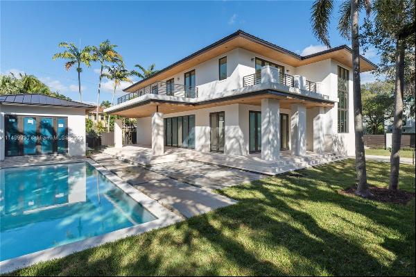 New construction contemporary masterpiece, perfectly positioned on a corner lot facing a t