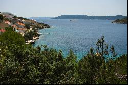 Seafront plot with a project near Trogir