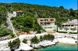 Seafront plot with a project near Trogir