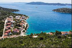 Seafront plot with a project near Trogir