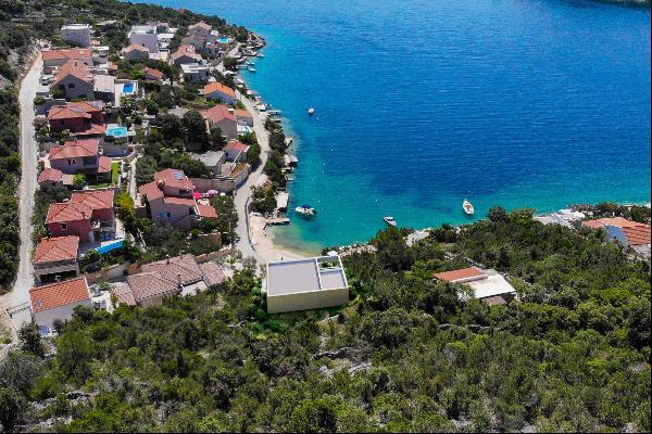 Seafront plot with a project near Trogir