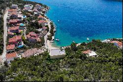 Seafront plot with a project near Trogir