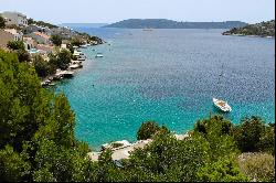 Seafront plot with a project near Trogir