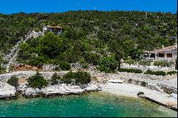 Seafront plot with a project near Trogir