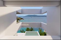 Seafront plot with a project near Trogir