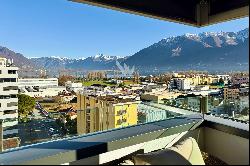 Modern penthouse apartment with lake view for sale in a central location in Locarno