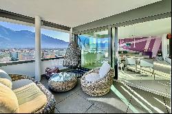 Modern penthouse apartment with lake view for sale in a central location in Locarno