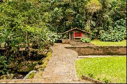 House in the mountains with a water spring and a helipad