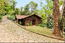 House in the mountains with a water spring and a helipad