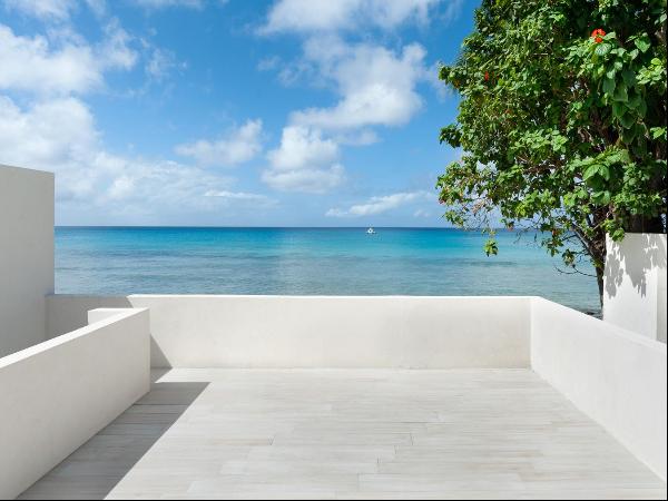 Modern beachfront retreat in Mullins, Barbados. 3 beds, 3 baths, stunning sea views, and a