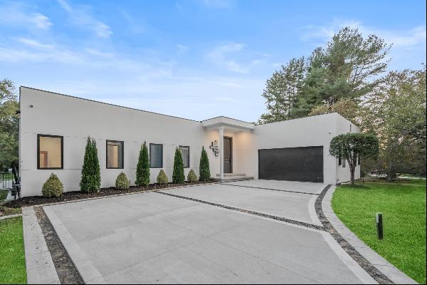 Welcome to the epitome of contemporary luxury living in this stunning ranch-style home, fu