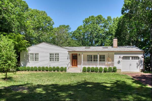 This charming turn-key home offers three bedrooms and three bathrooms on a half-acre lot l