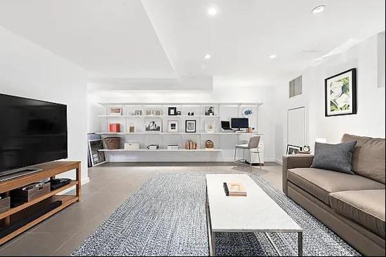 Set in a contemporary condominium one block from McCarren Park, this impeccably designe