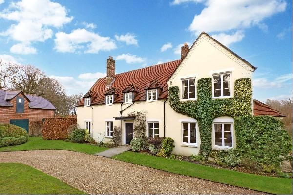 An elegant, detached house and annexe with impressive gardens and grounds.