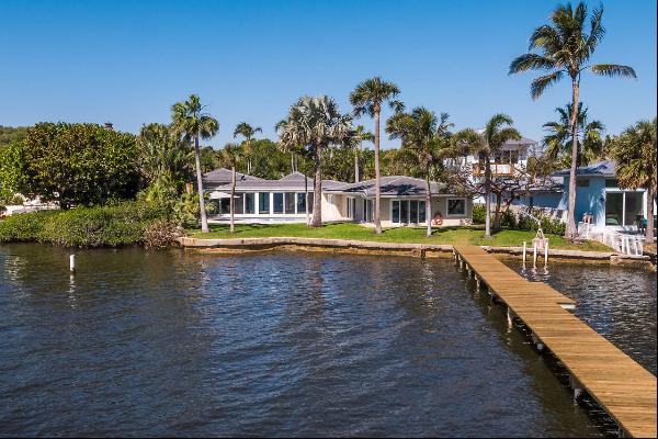 This exceptional property presents stunning intracoastal views upon entering the modern, m