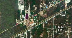 5592:Land for sale by highway Cancun Leona Vicario, Cancun 77590