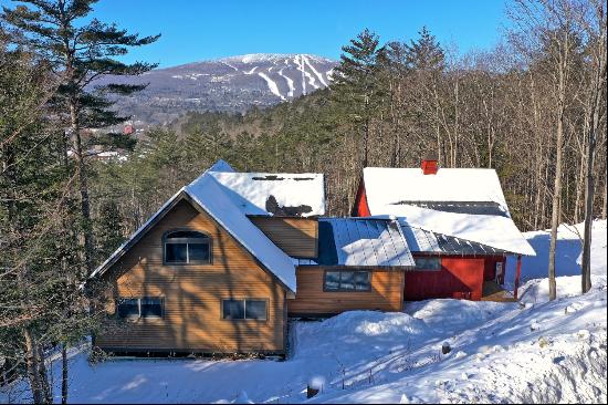 Tucked away on a private road with views of Okemo