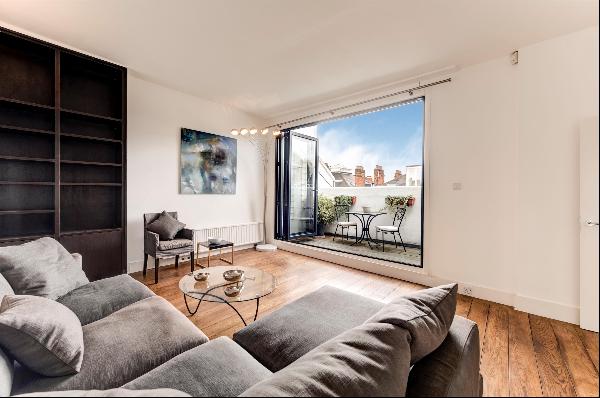 A wonderfully light two bedroom apartment situated on Roland Gardens SW7
