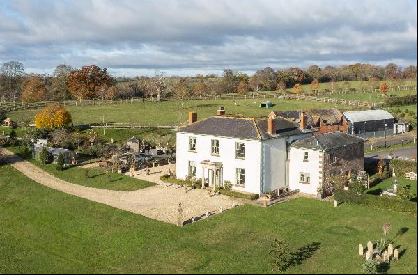 A ring fenced farm centering on a handsome period farmhouse with versatile outbuildings an