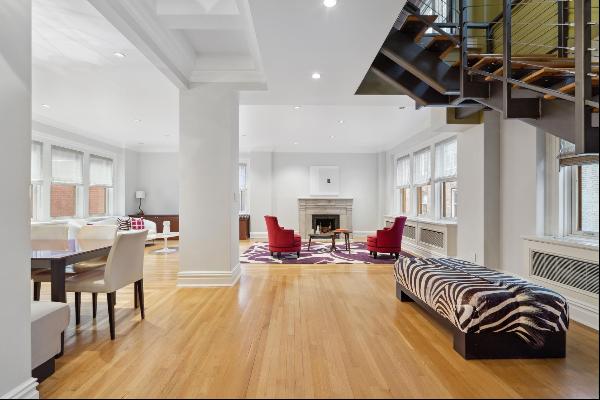 Step into a meticulously renovated duplex residence that seamlessly blends prewar elegance