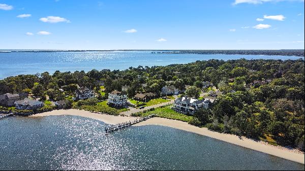 Architectural masterpiece situated on 175' of private sandy beachfront on the south side o