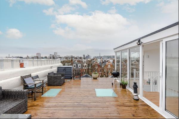 Stunning three bed apartment on Sutherland Avenue with a decked roof terrace overlooking l