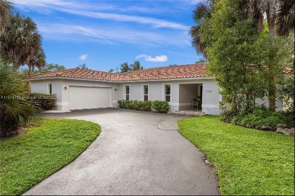 Rare gem available in the coveted guard gated S. Gables Kings Bay community. This warm and
