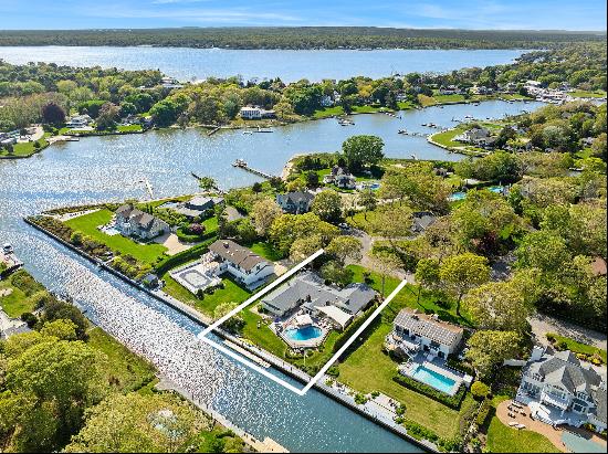 Located within the exclusive Old Harbor Colony Community in Hampton Bays, this stunning wa