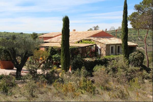A property with a swimming pool and grounds for sale in Murs.