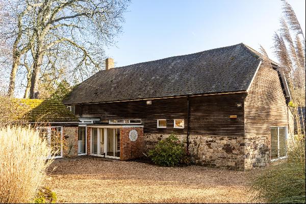 A fantastic opportunity to acquire a five bedroom converted barn & ancillary accommodation