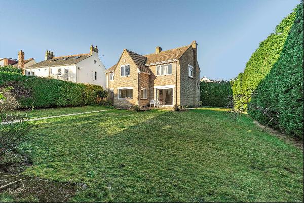 Wonderful family home on a large corner plot with a south-facing garden