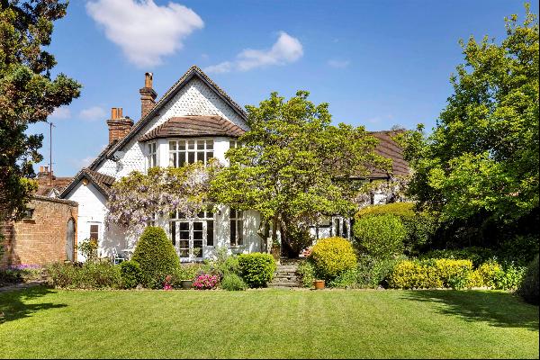 An iconic Grade II listed period house in the heart of one of Surrey’s best villages.