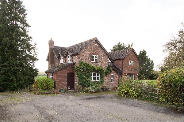 An extended country cottage with detached annexe, paddock, orchard and views of the Wye va