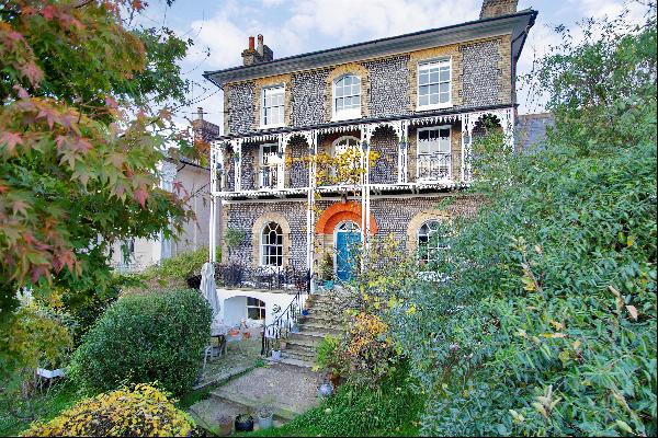 An elegant, Grade II Listed attached family home arranged over four storeys, situated in t