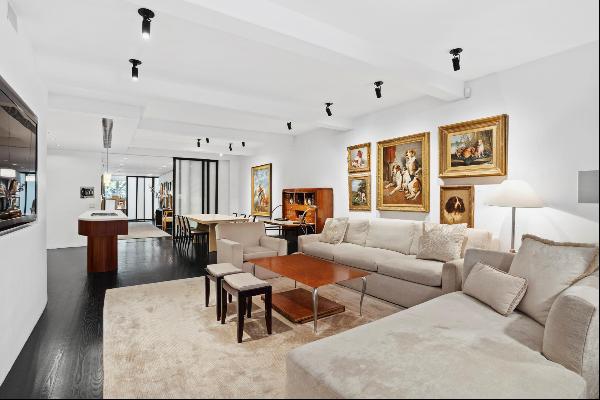 Chic and well-appointed, this full-floor loft apartment situated on a quiet tree-lined str