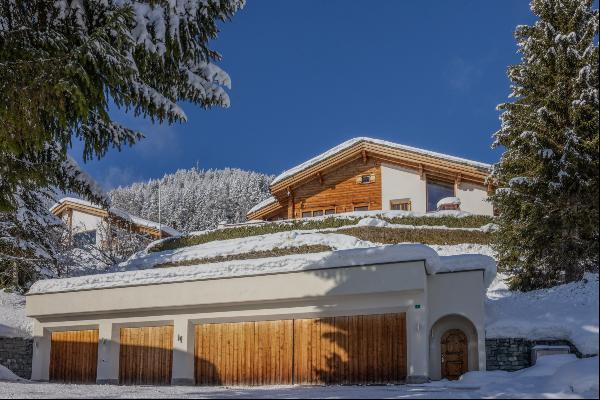 8-room chalet with two flats in an exclusive ski-in/ski-out location.