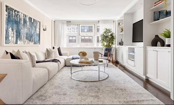 Welcome to this meticulously renovated and sprawling three-bedroom, two-bathroom apartment