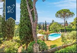 Elegant two-family villa with a panoramic pool and a garden on Florence's hills