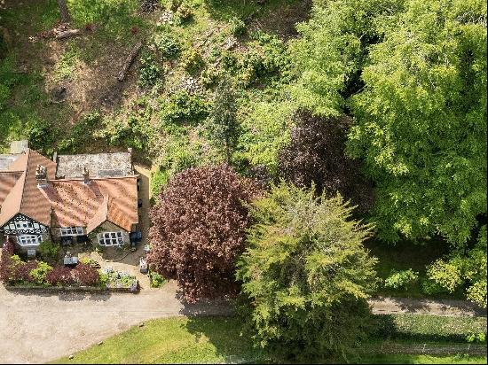 One of a pair of lodge cottages, being individually sold.